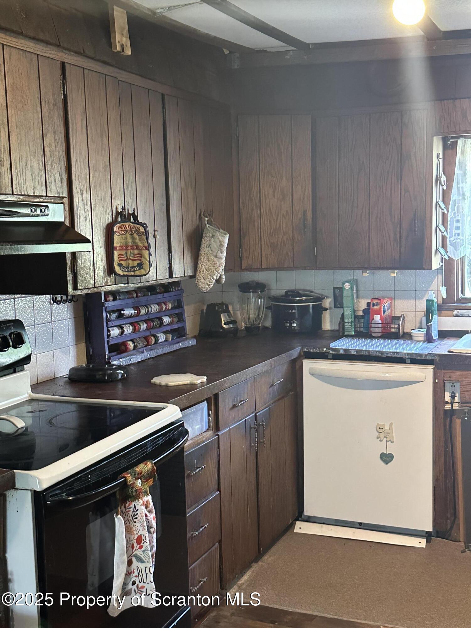 3061-3065 Main Street Clarks Summit, PA 18411 - Photo 25 of 34 a kitchen with stainless steel appliances granite countertop a stove and a microwave