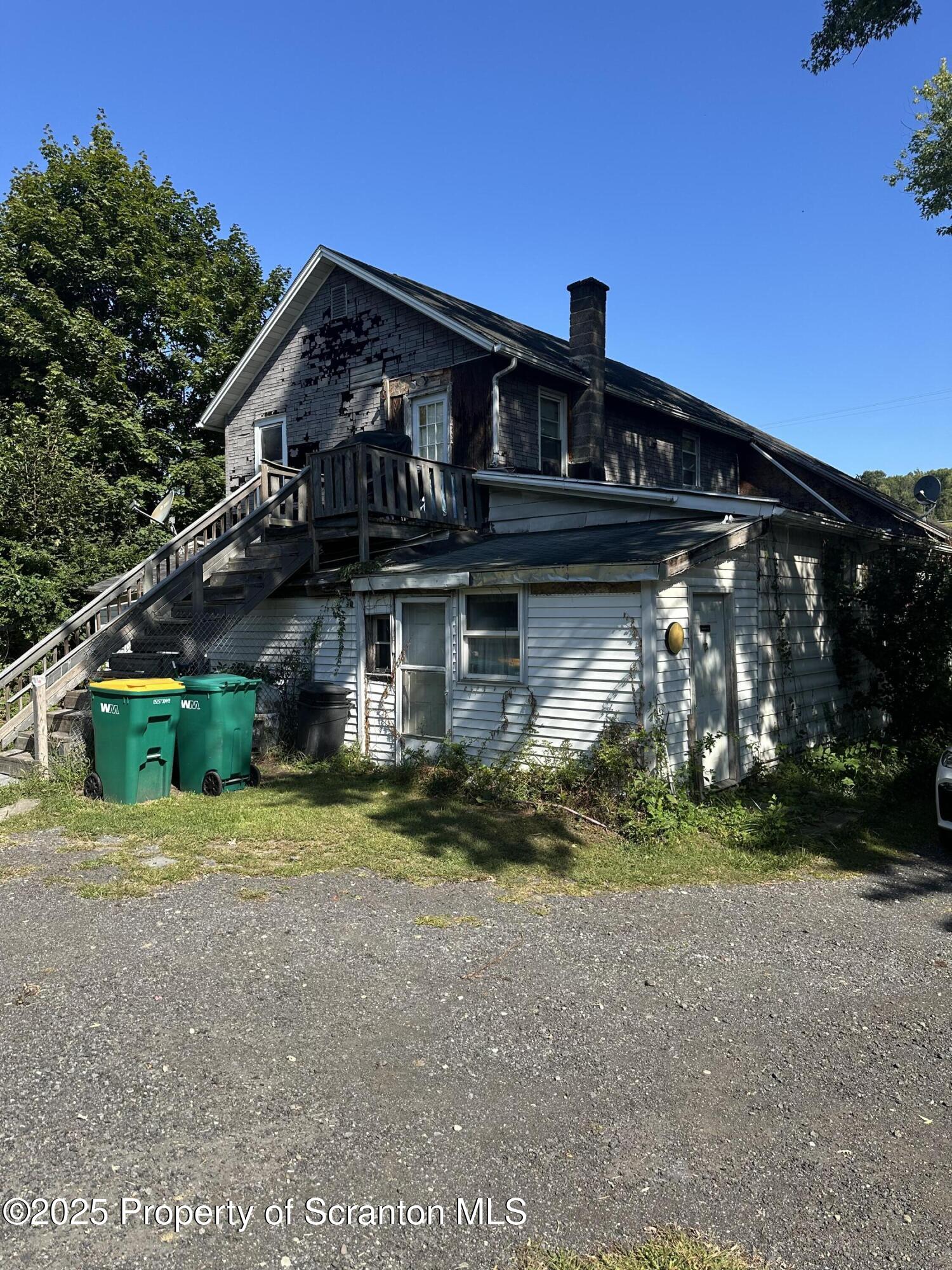 3061-3065 Main Street Clarks Summit, PA 18411 - Photo 5 of 34 a front view of a house with a yard
