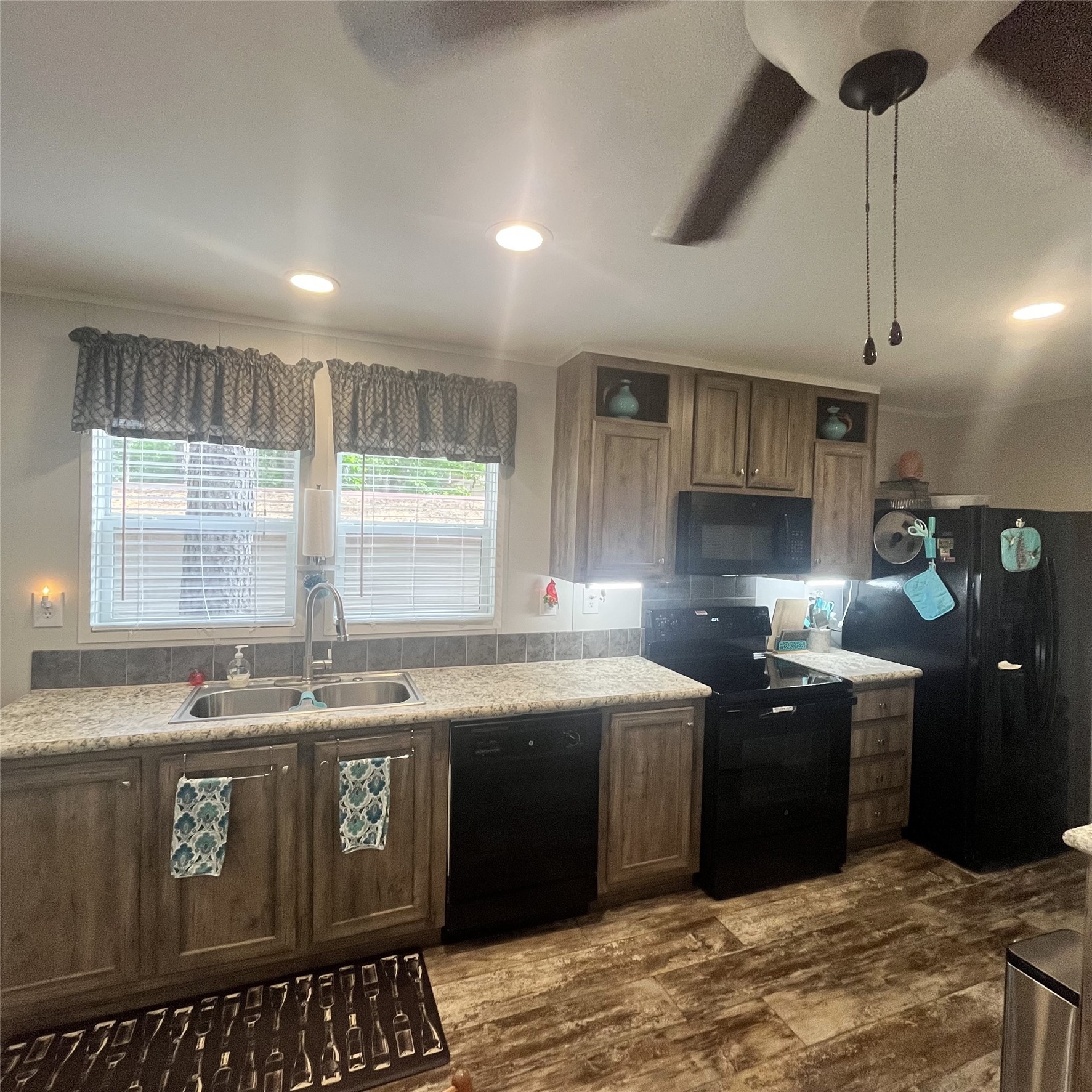 5002 Fm 811 Centerville, TX 75833 - Photo 20 of 31 a kitchen with stainless steel appliances granite countertop a sink a stove a refrigerator a counter top space and cabinets