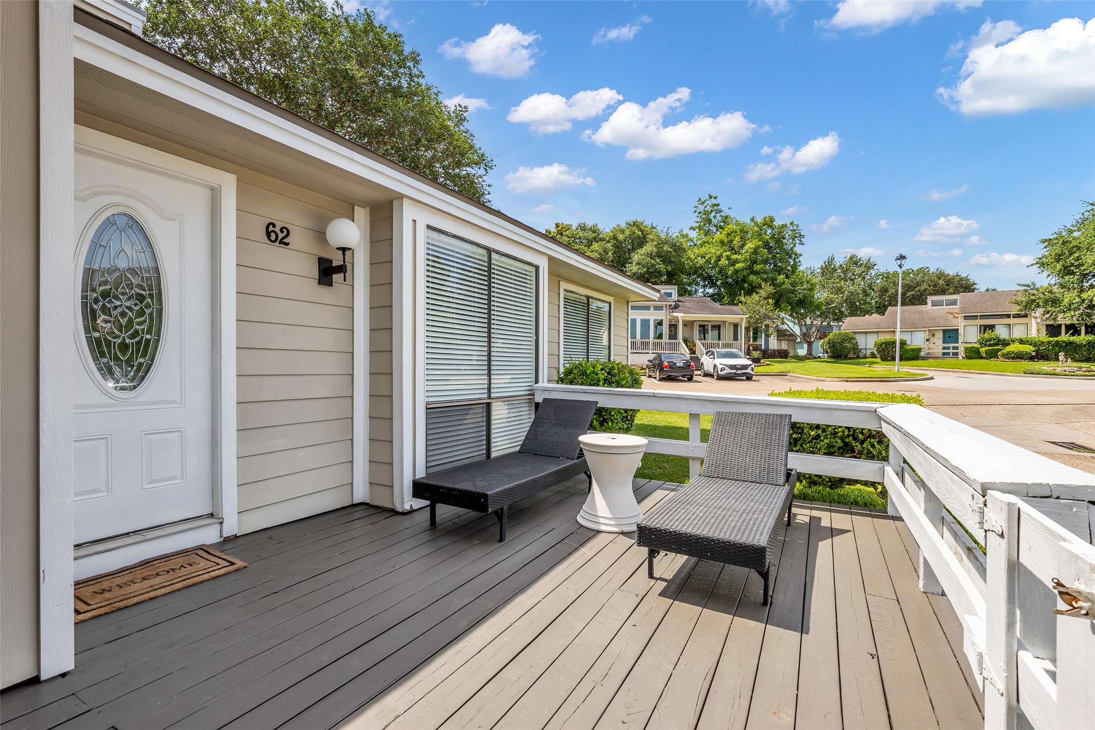 62 April Point Drive North Conroe, TX 77356 - Photo 6 of 25 a balcony with wooden floor table and chairs