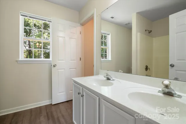 a white toilet sitting next to a bath tub