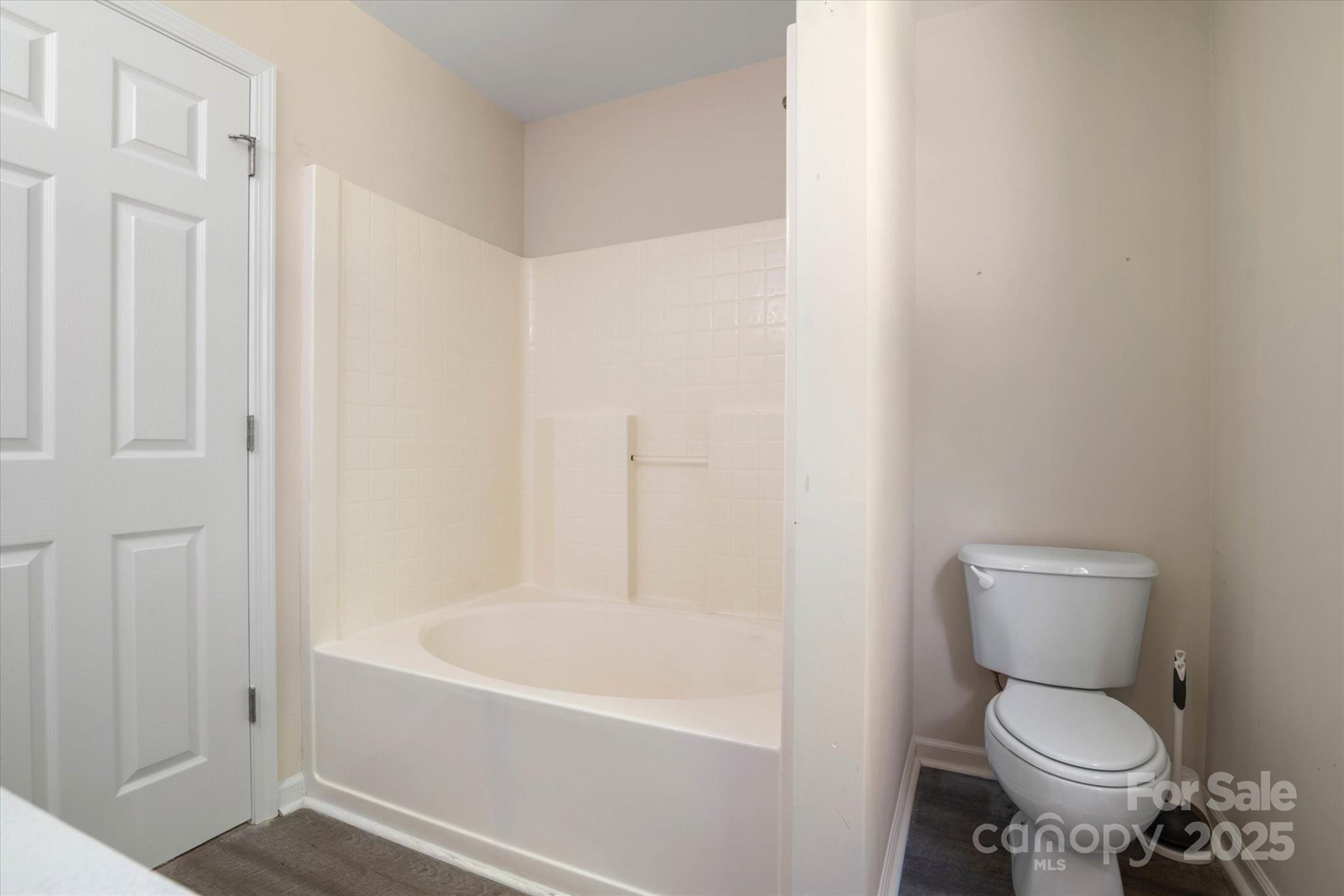 1620 Tate Road Rock Hill, SC 29732 - Photo 16 of 33 a white toilet sitting next to a bath tub