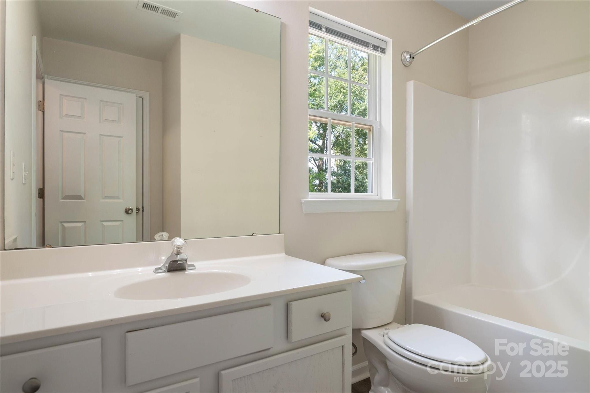 1620 Tate Road Rock Hill, SC 29732 - Photo 21 of 33 a bathroom with a sink a toilet and a mirror
