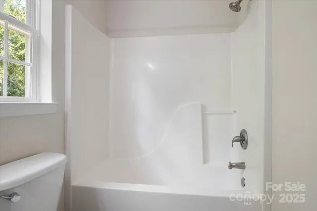 a view of a room that has a window in it