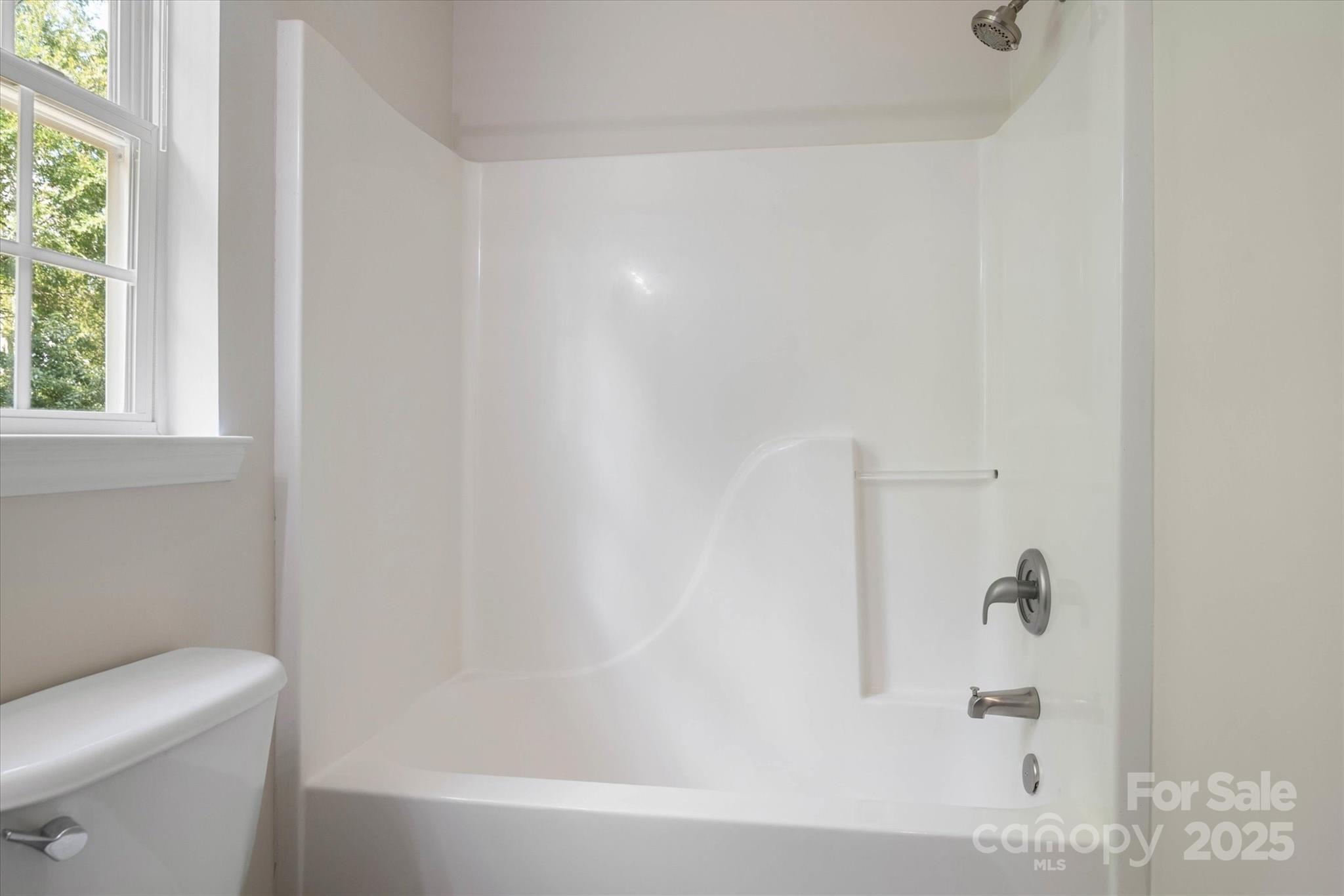 1620 Tate Road Rock Hill, SC 29732 - Photo 22 of 33 a bathroom with a bathtub and a toilet