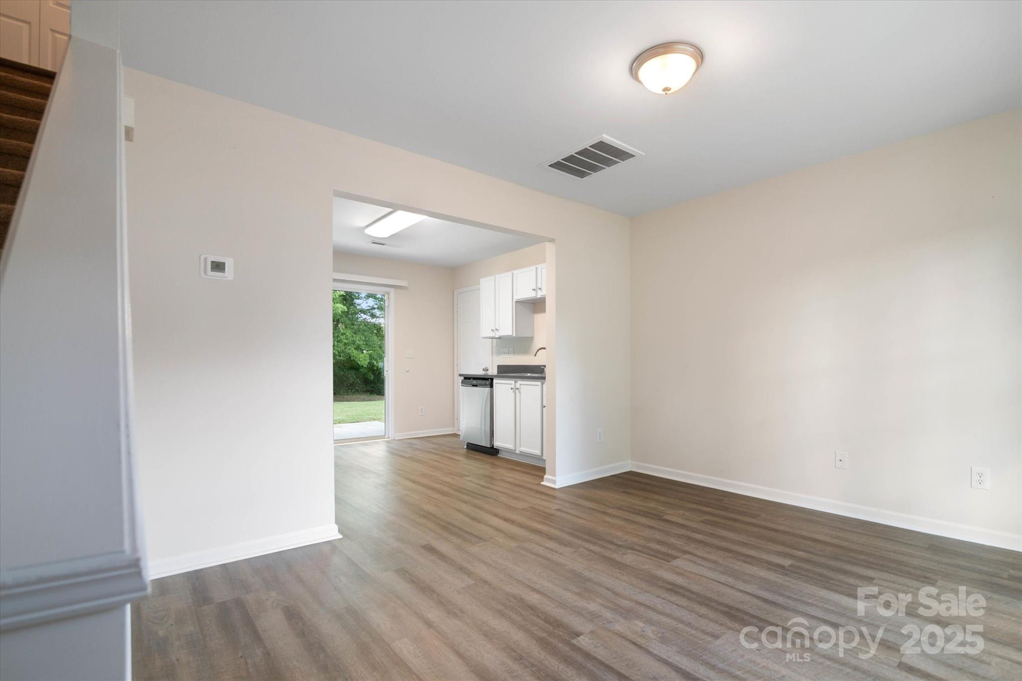 1620 Tate Road Rock Hill, SC 29732 - Photo 6 of 33 a view of a kitchen and an empty room with wooden floor