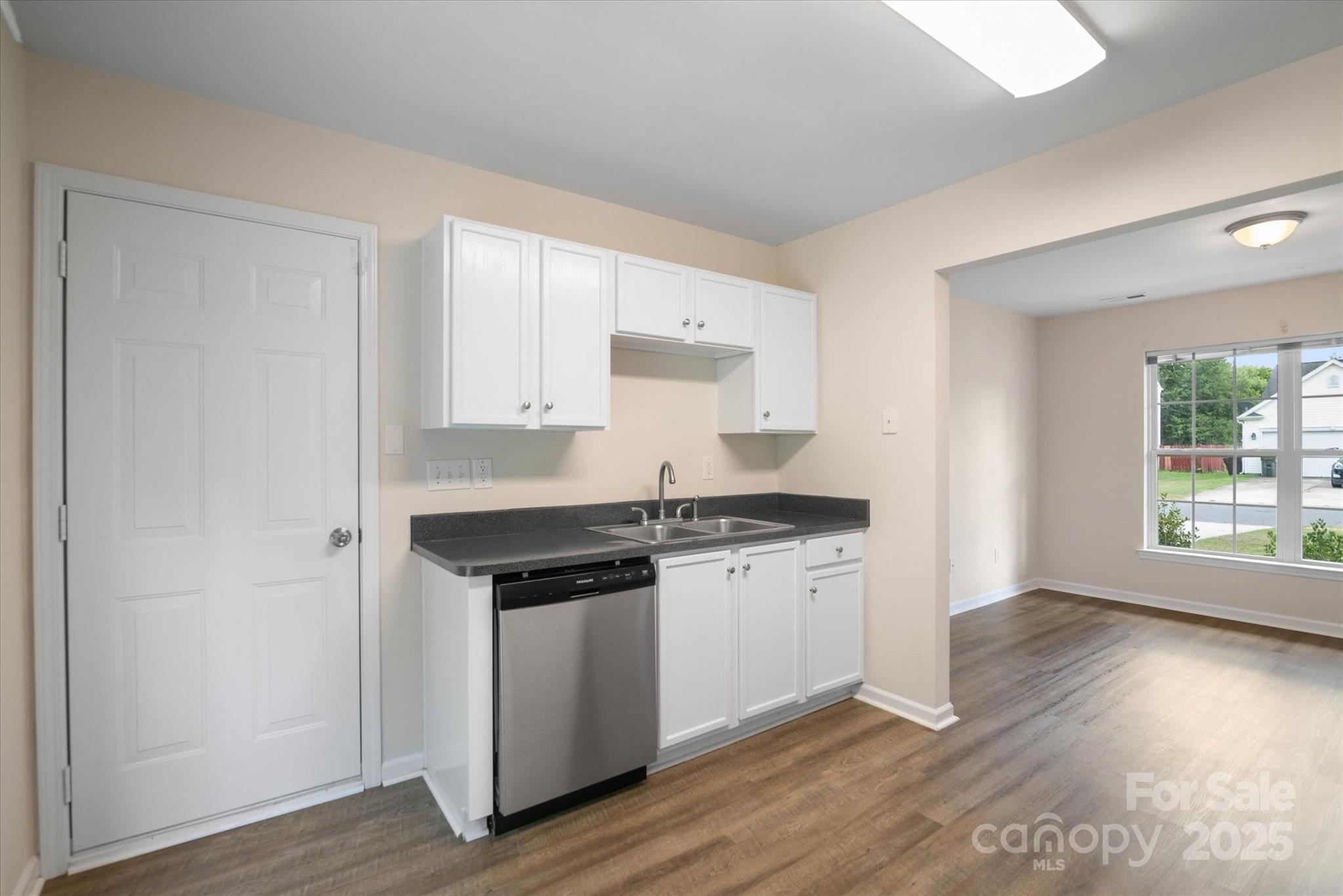 1620 Tate Road Rock Hill, SC 29732 - Photo 10 of 33 a kitchen with stainless steel appliances granite countertop a stove and a white cabinets