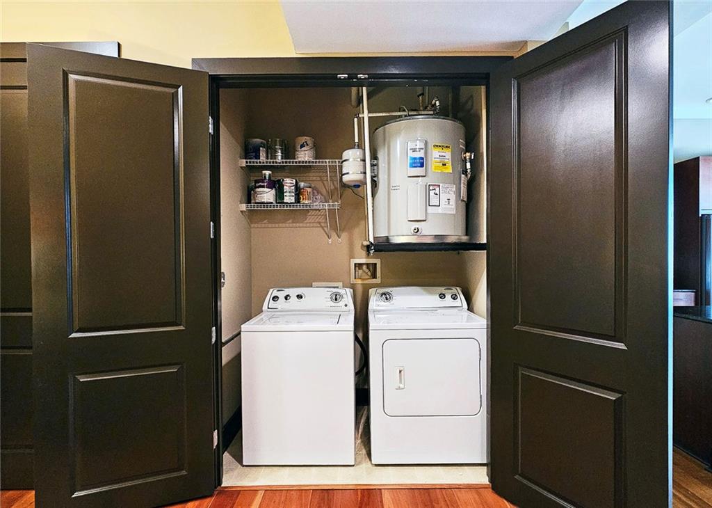 4561 Olde Perimeter Way, Unit 1202 Atlanta, GA 30346 - Photo 20 of 46 a utility room with dryer and washer