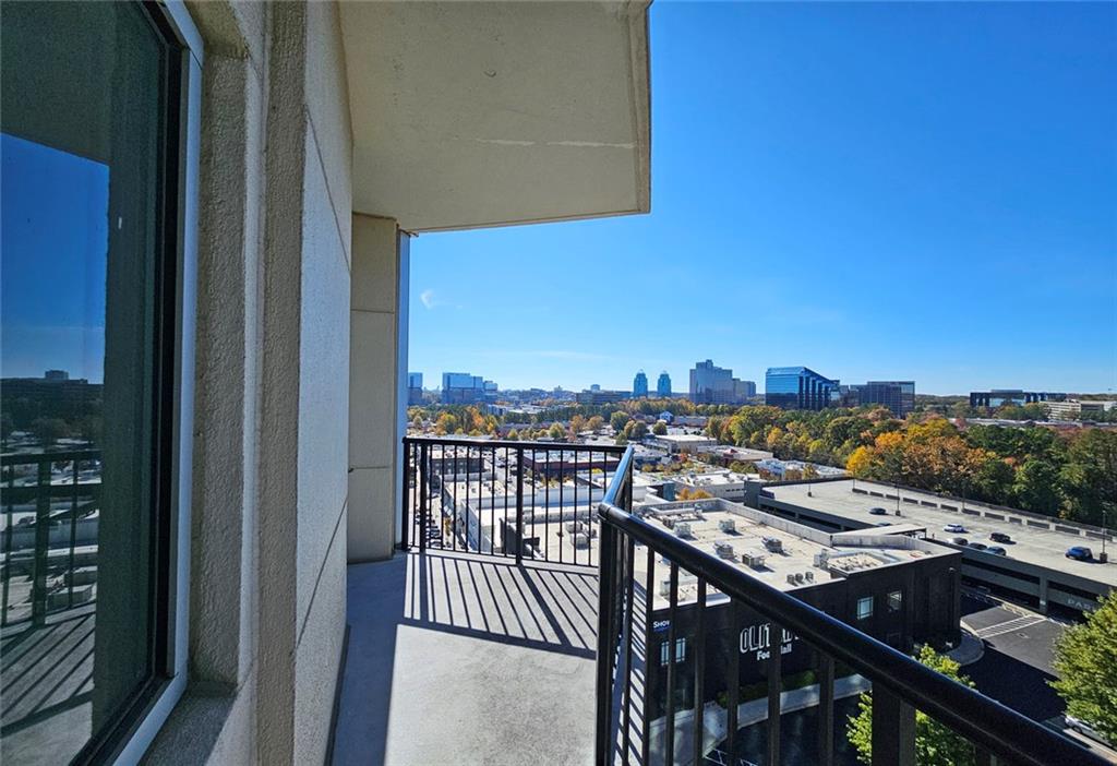 4561 Olde Perimeter Way, Unit 1202 Atlanta, GA 30346 - Photo 22 of 46 a view of a balcony