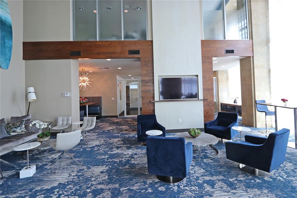 4561 Olde Perimeter Way, Unit 1202 Atlanta, GA 30346 - Photo 30 of 46 a living room with furniture