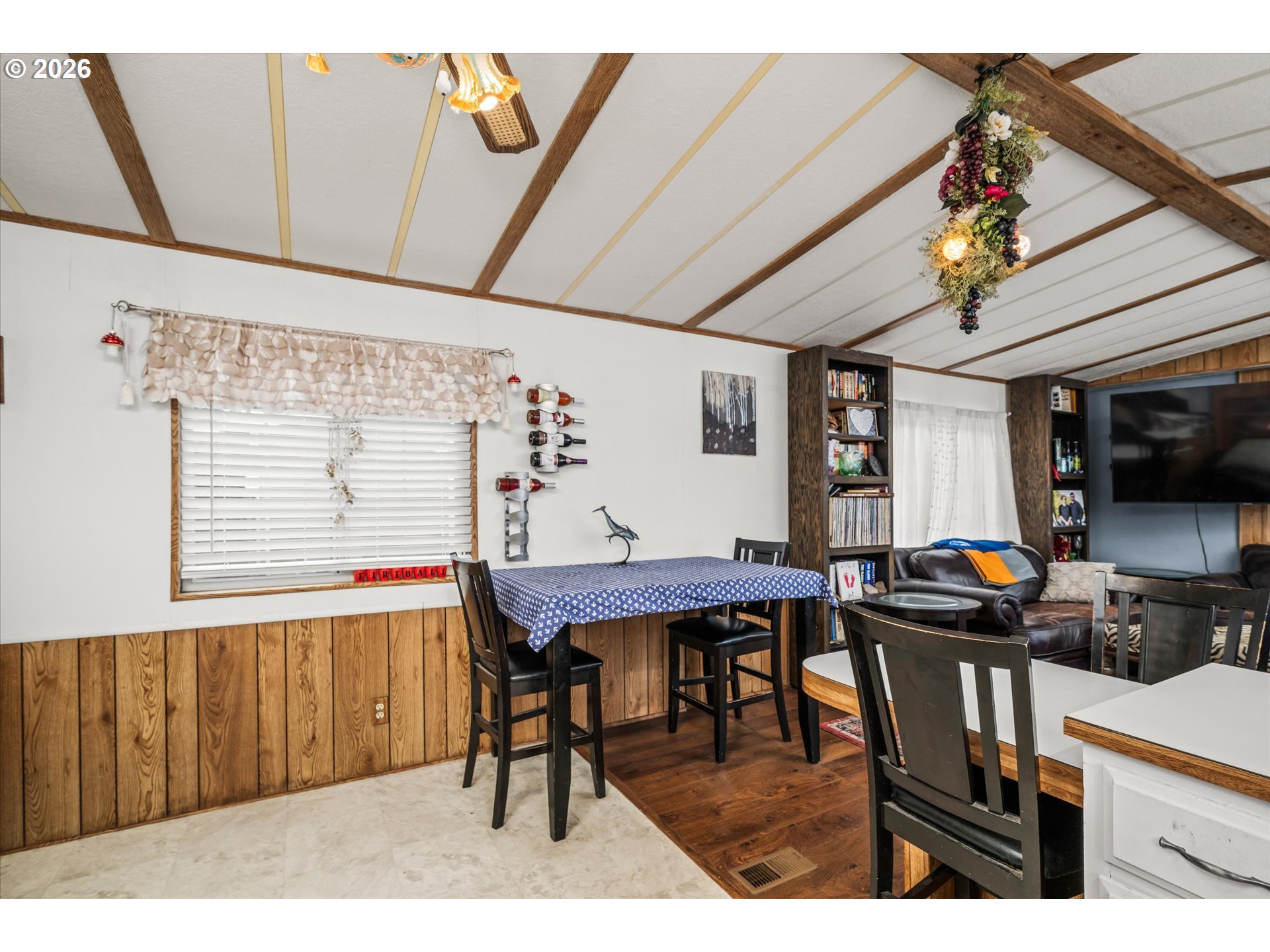 2150 Laura Street, Unit 111 Springfield, OR 97477 - Photo 8 of 21 a view of a dining room with furniture window and wooden floor