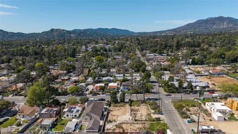 a view of a city with mountains in the background