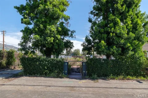 a view of a house with a snow in the background