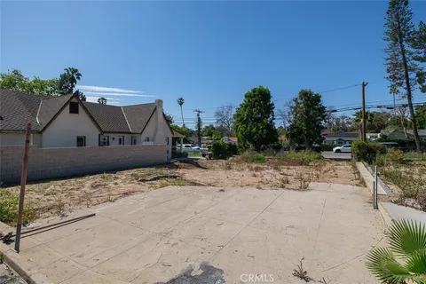 a view of a street with a building in the background