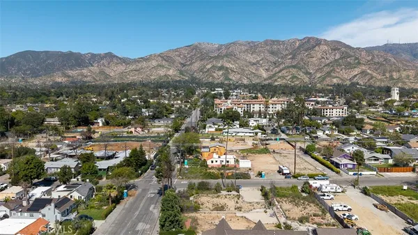 an aerial view of residential houses and outdoor space
