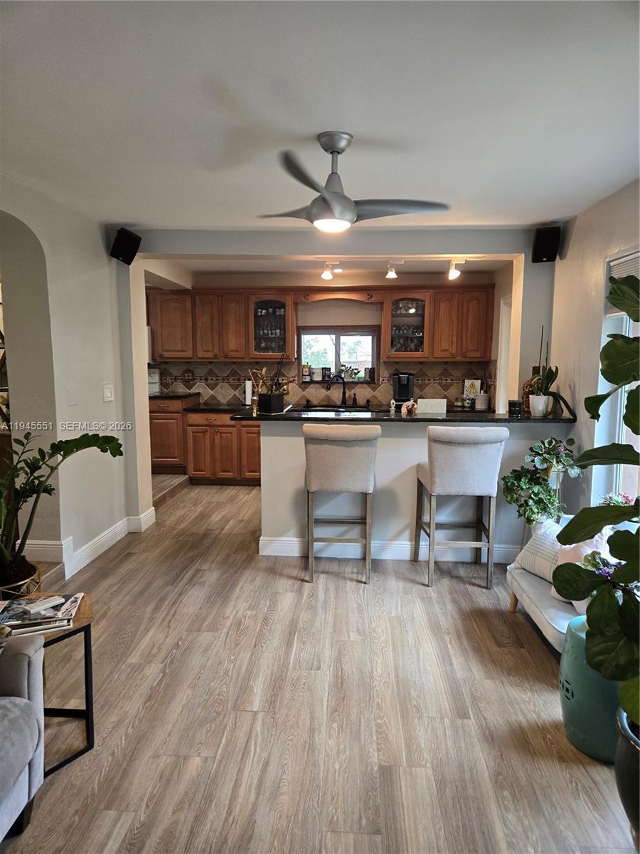 6250 Southwest 19th Street Miami, FL 33155 - Photo 11 of 35 a kitchen with a sink appliances and wooden floor
