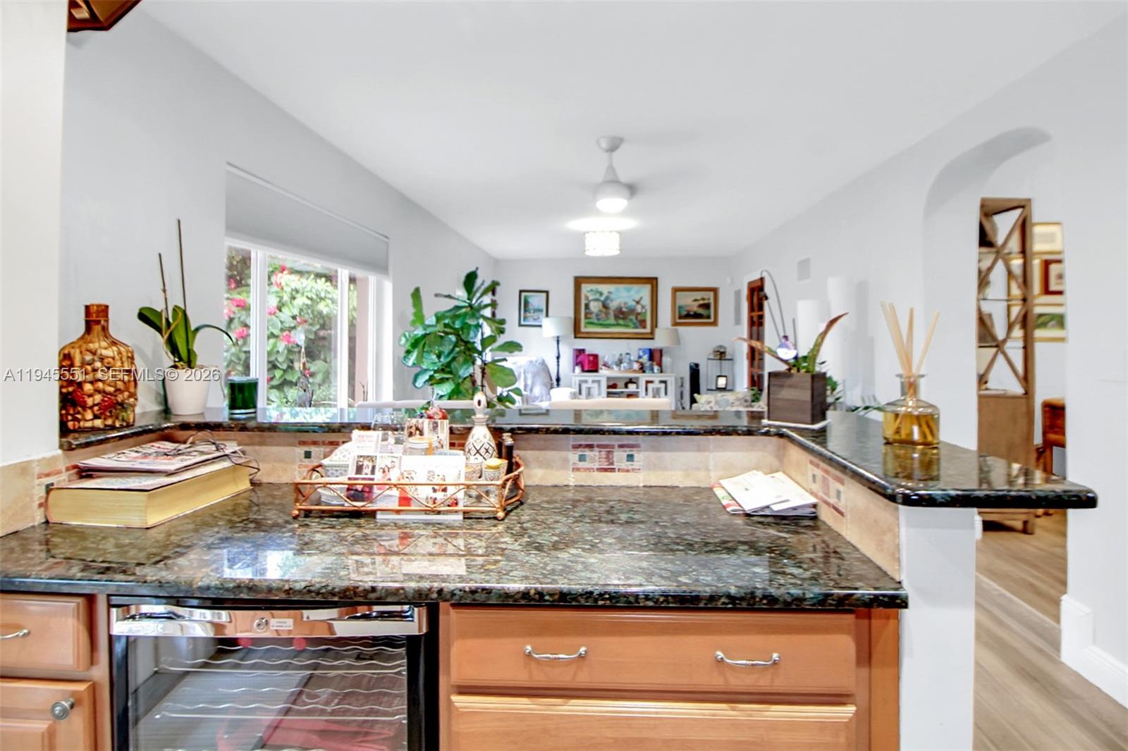 6250 Southwest 19th Street Miami, FL 33155 - Photo 12 of 35 a kitchen with granite countertop a sink and a window