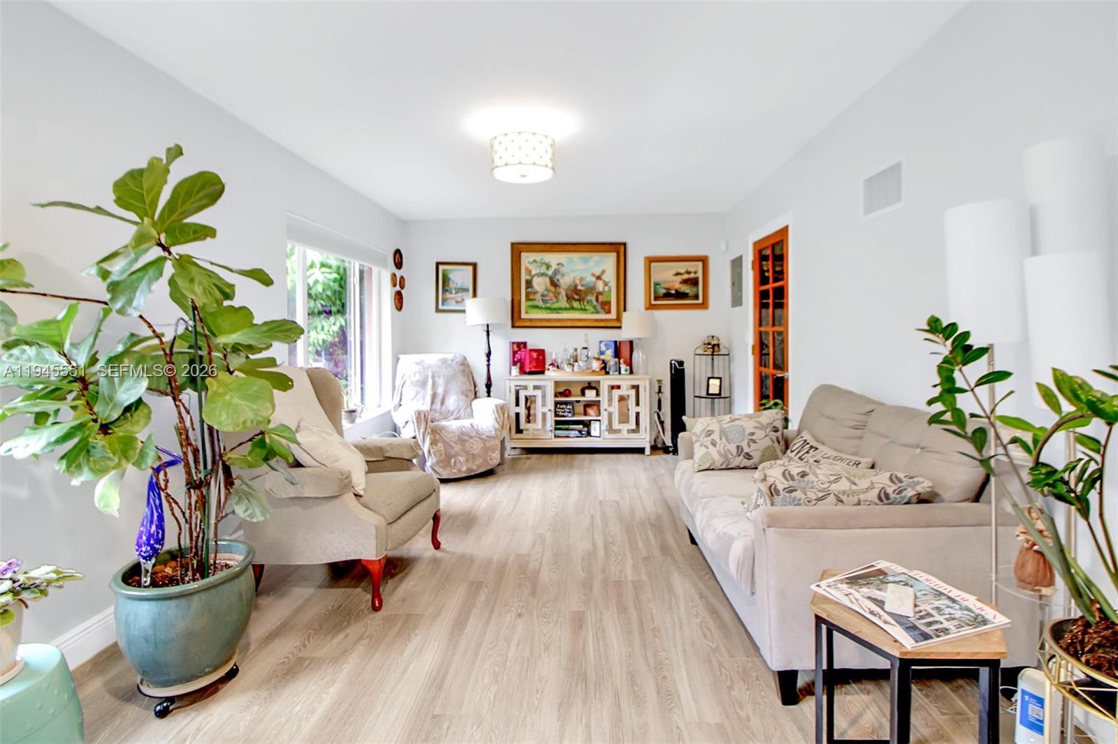 6250 Southwest 19th Street Miami, FL 33155 - Photo 16 of 35 a living room with furniture and a potted plant