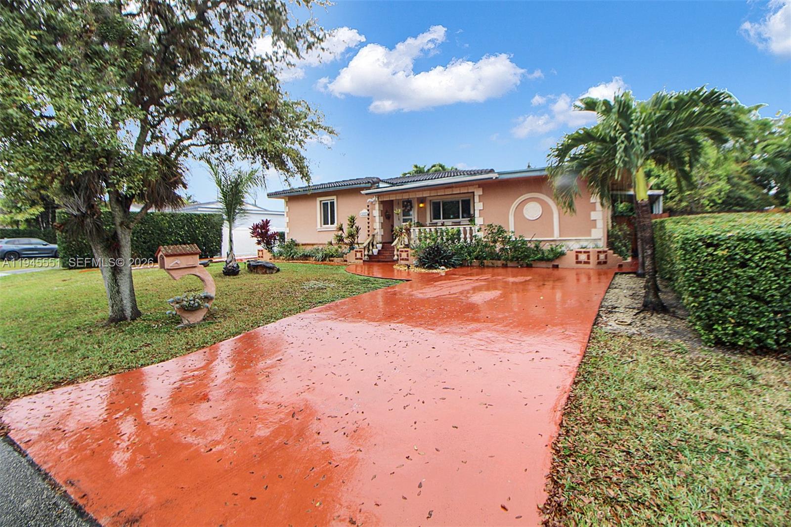 6250 Southwest 19th Street Miami, FL 33155 - Photo 2 of 35 a view of a backyard with a garden and plants
