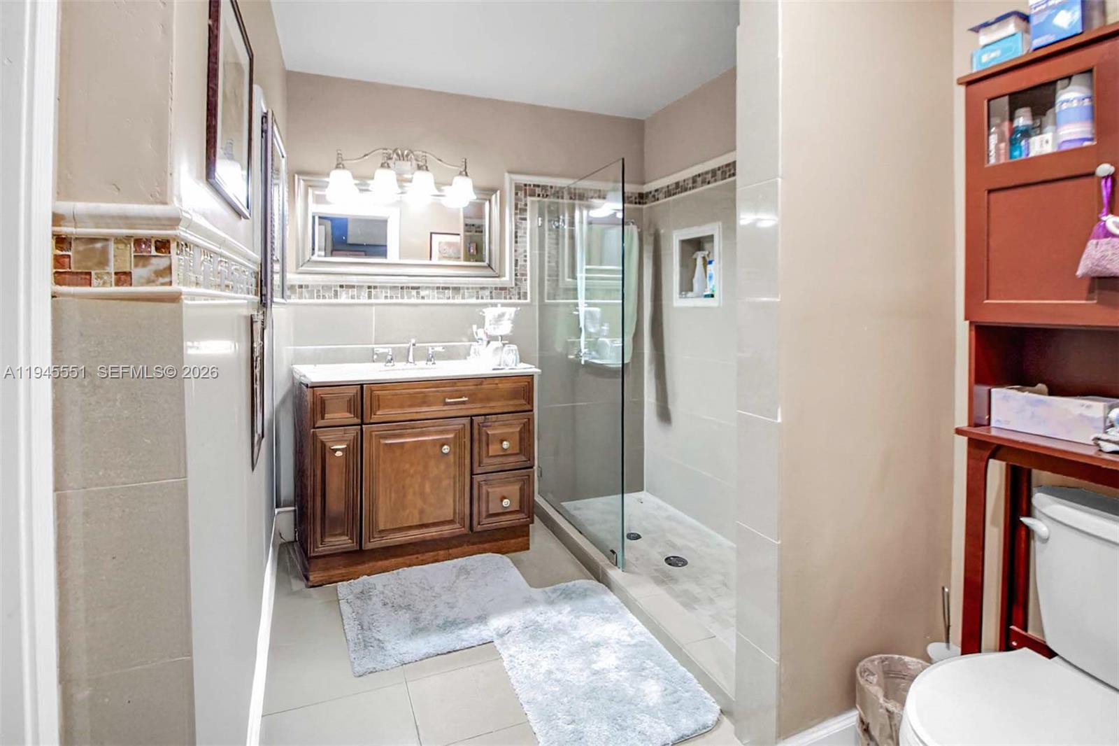 6250 Southwest 19th Street Miami, FL 33155 - Photo 23 of 35 a bathroom with a granite countertop sink toilet and shower