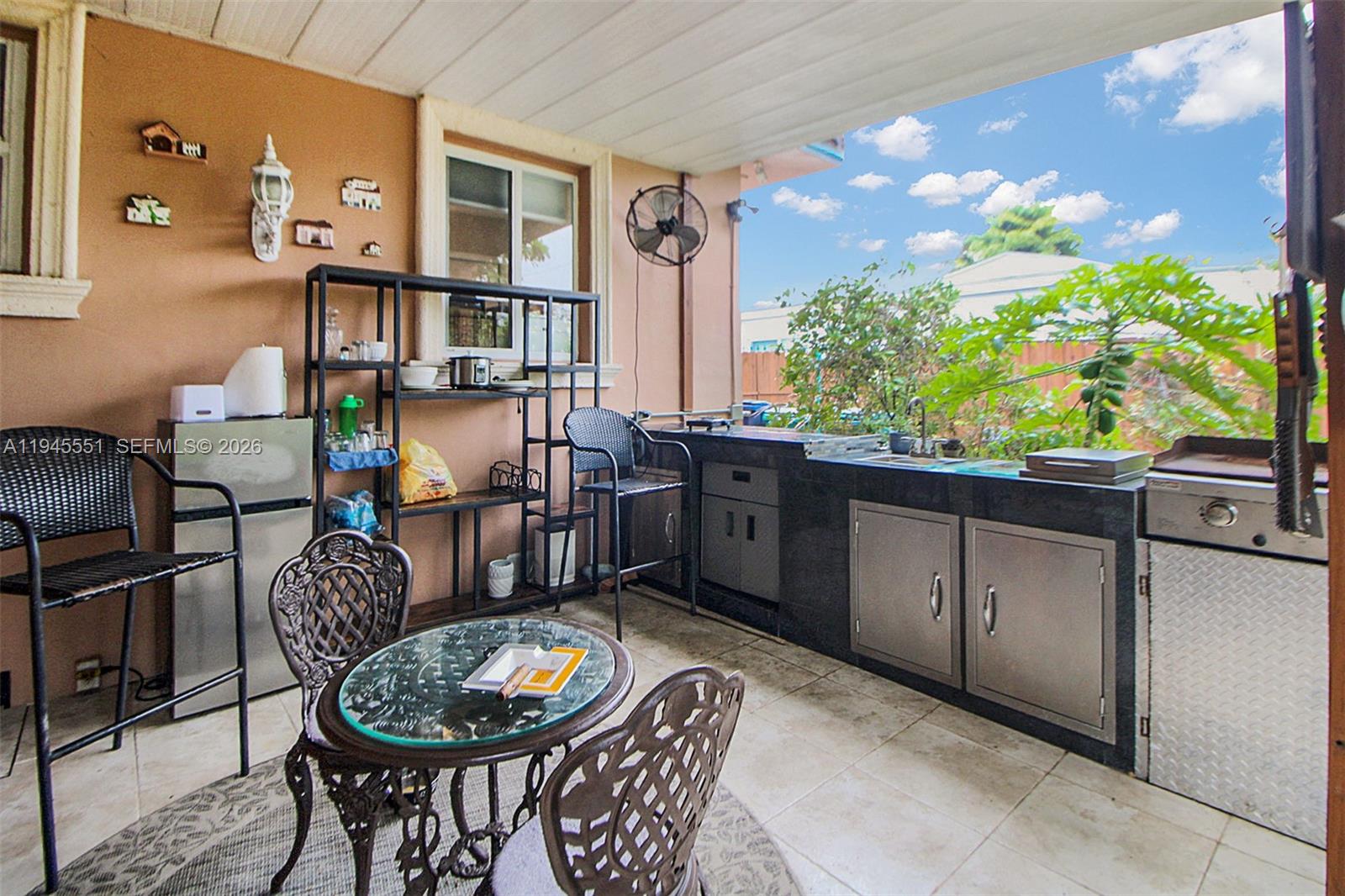 6250 Southwest 19th Street Miami, FL 33155 - Photo 24 of 35 a living room with furniture and a potted plant