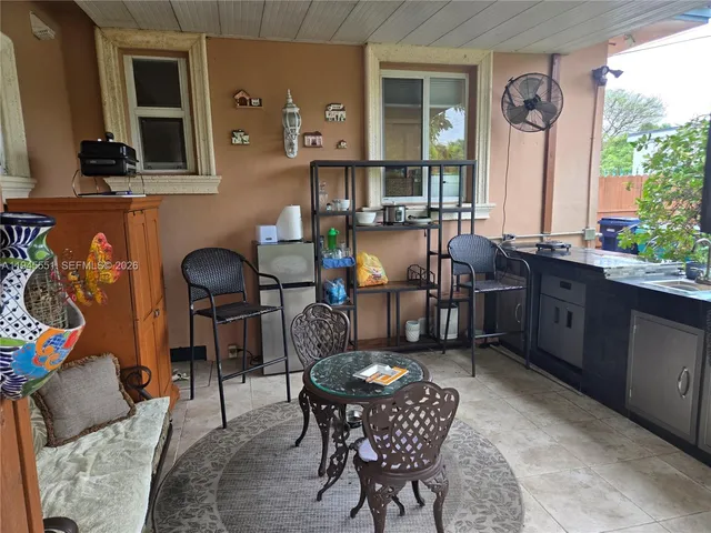 a view of a livingroom with furniture and a window