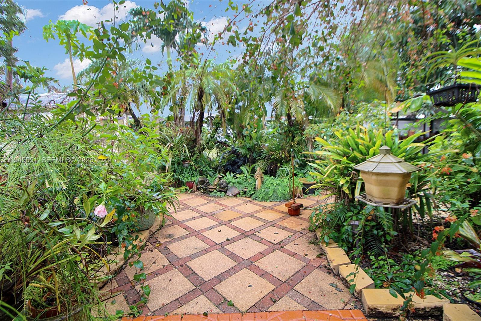 6250 Southwest 19th Street Miami, FL 33155 - Photo 31 of 35 a view of a backyard with sitting area