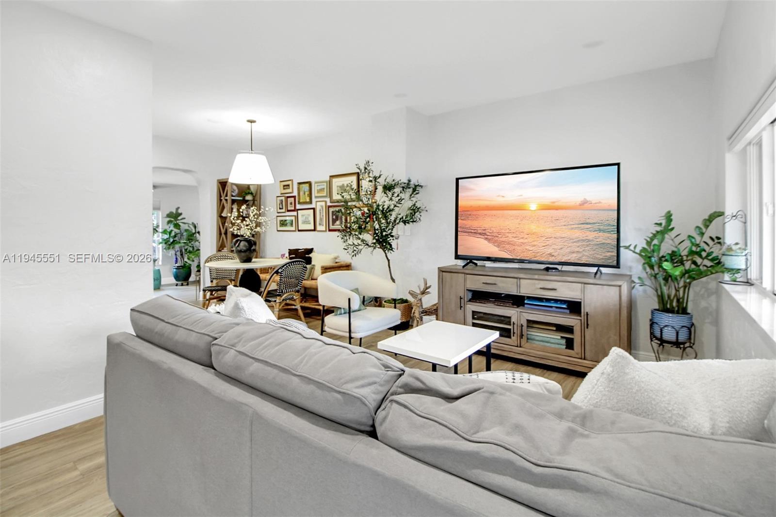 6250 Southwest 19th Street Miami, FL 33155 - Photo 5 of 35 a living room with furniture and a flat screen tv
