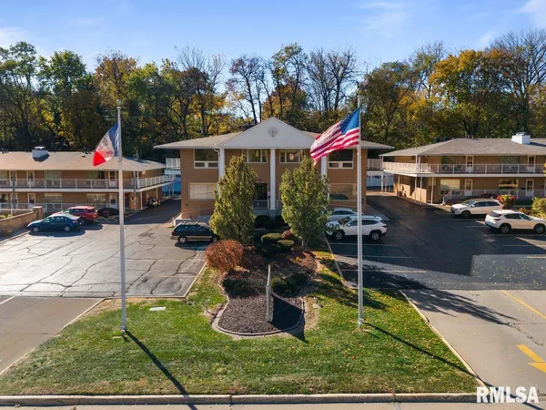 swimming pool view with a seating space and a garden