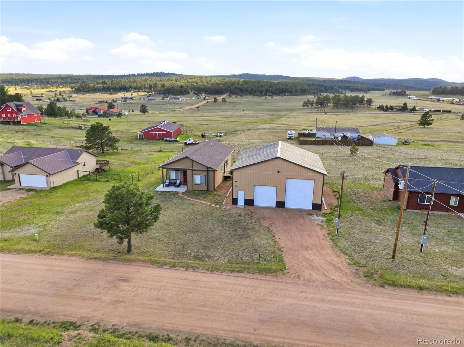 489 Duesouth Road Florissant, CO 80816 - Photo 33 of 40 an aerial view of a house with outdoor space and lake view