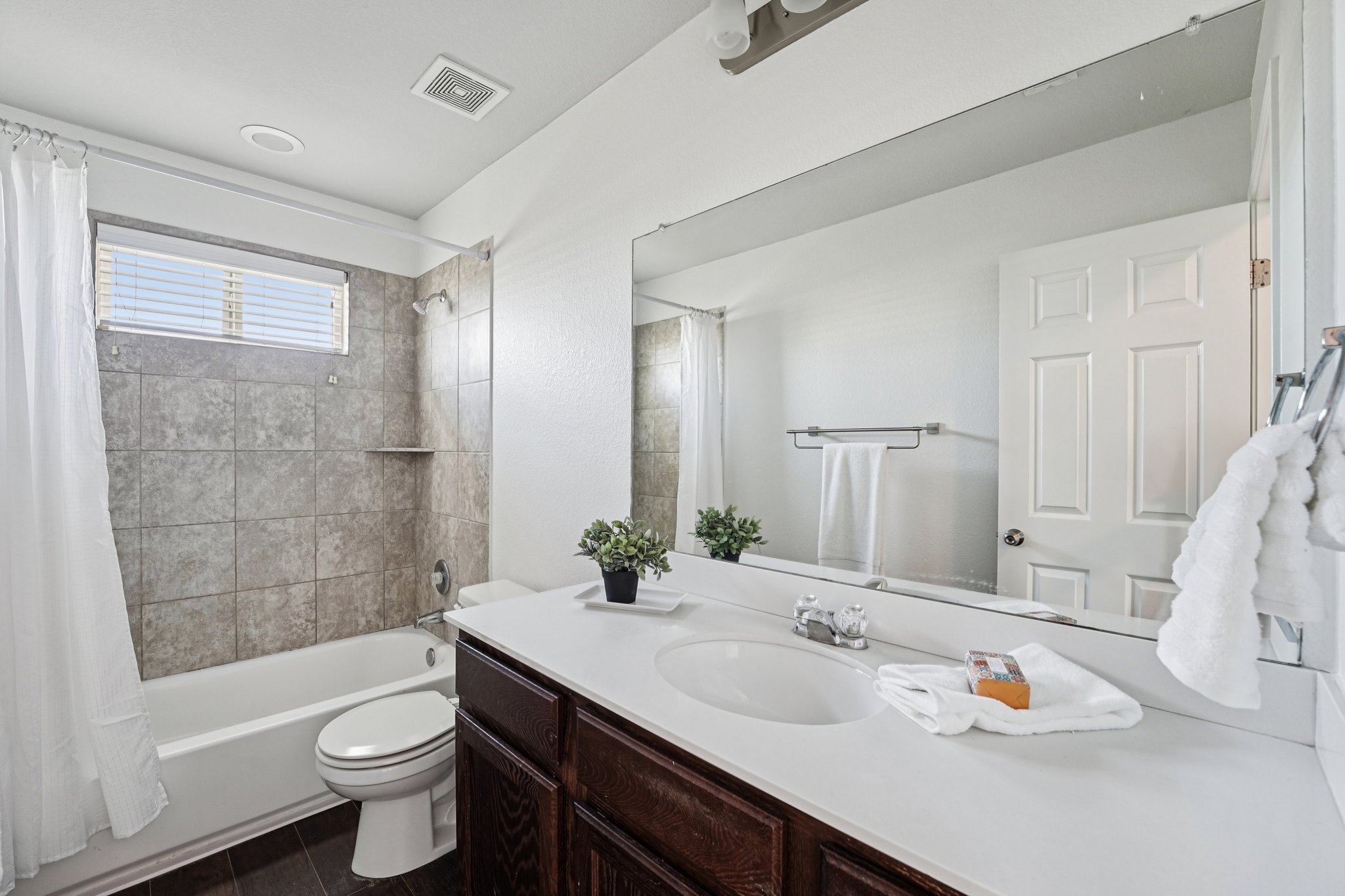 288 Triumph Road Buda, TX 78610 - Photo 13 of 19 a bathroom with a bathtub shower sink and toilet