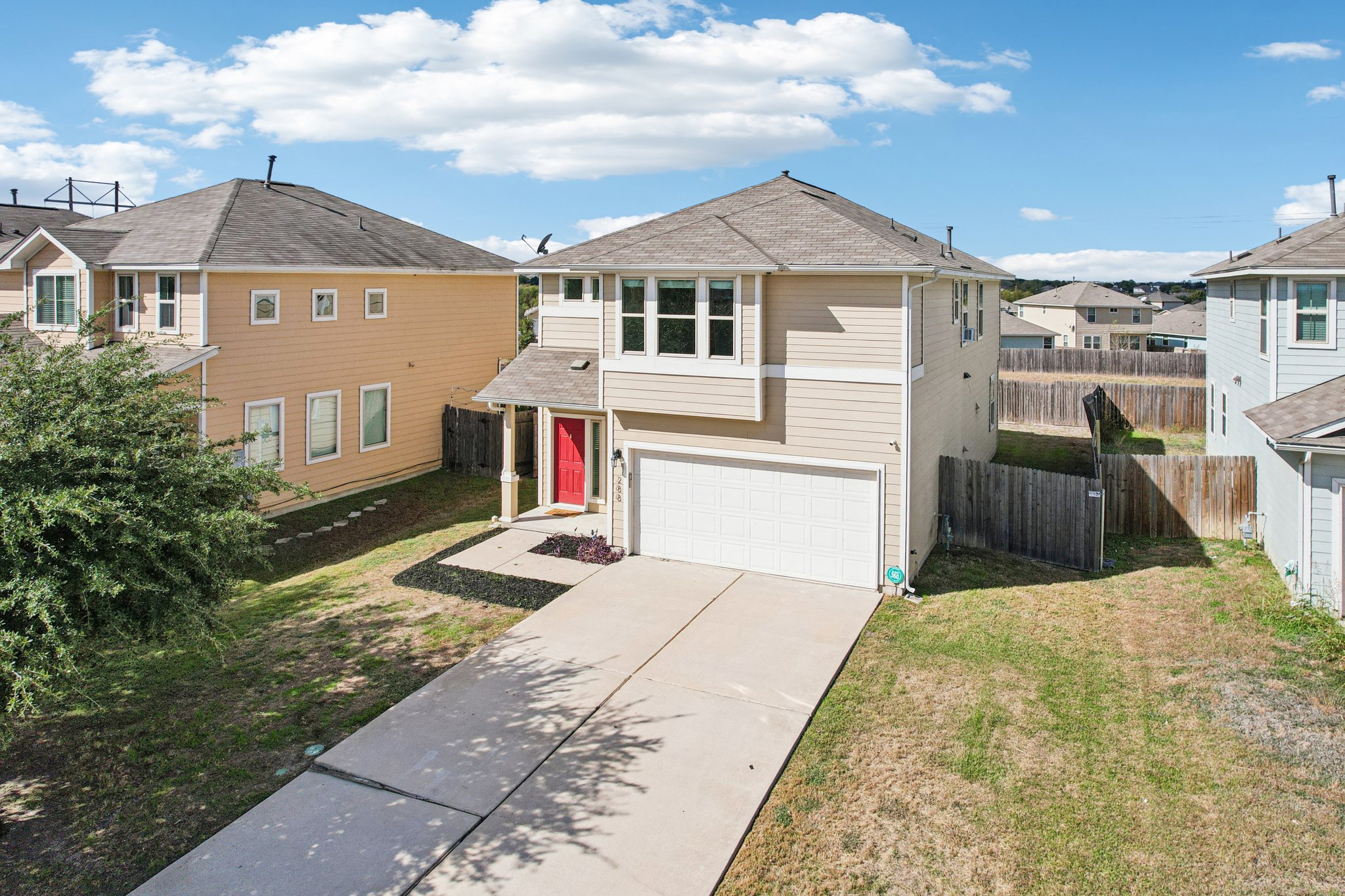 288 Triumph Road Buda, TX 78610 - Photo 15 of 19 a front view of a house with a yard