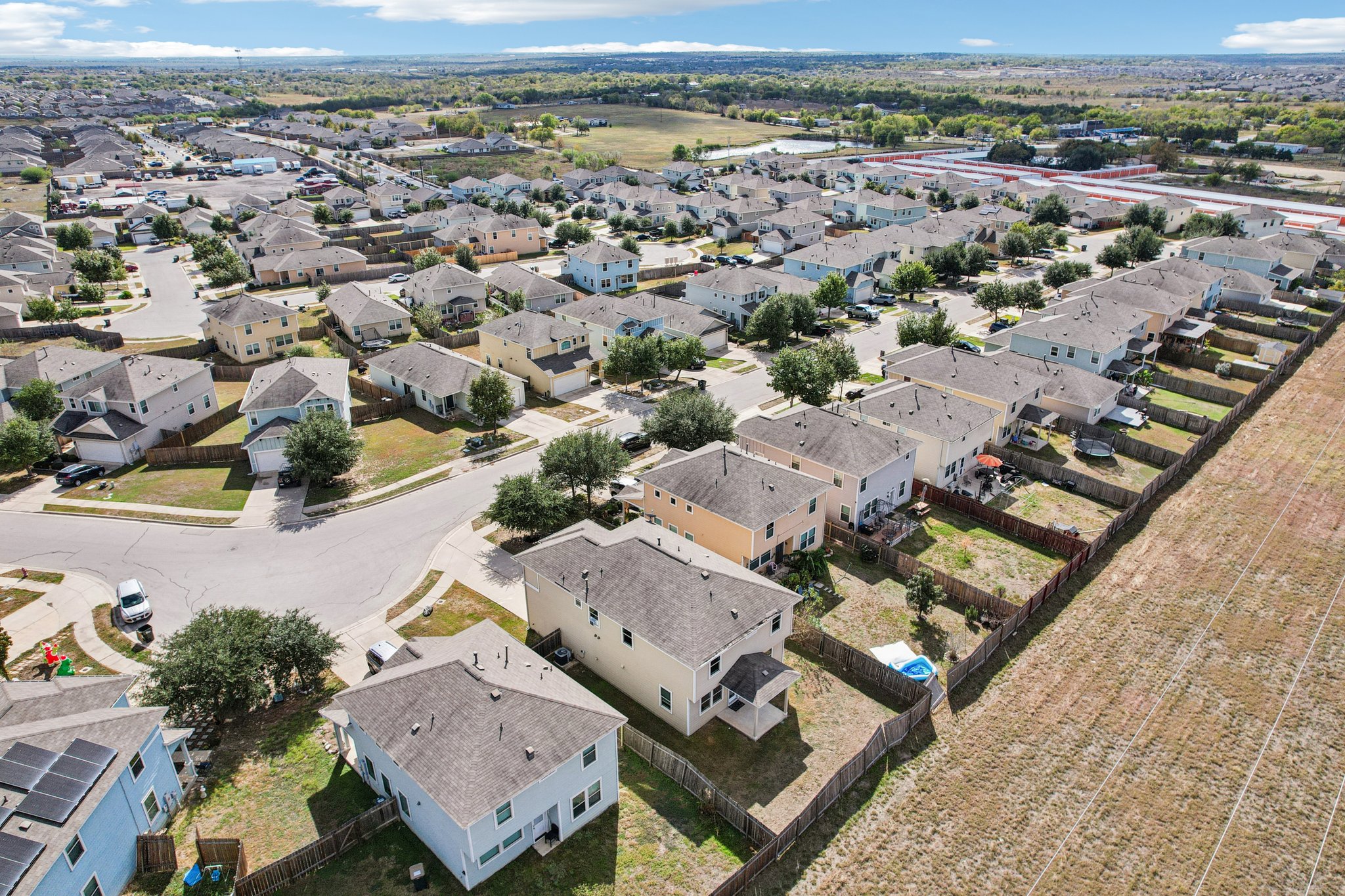 288 Triumph Road Buda, TX 78610 - Photo 18 of 19 an aerial view of a city with lots of residential buildings