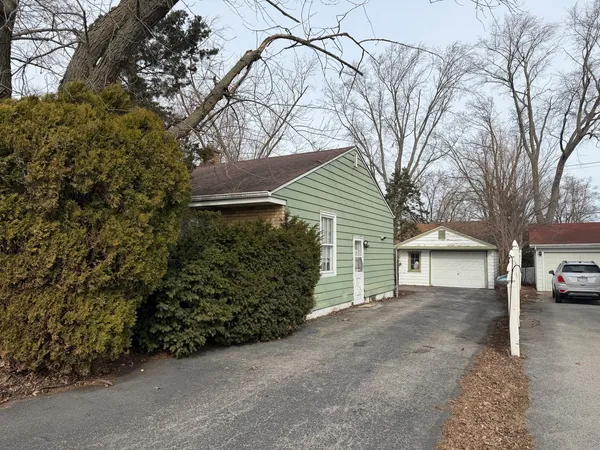 front view of a house with a trees