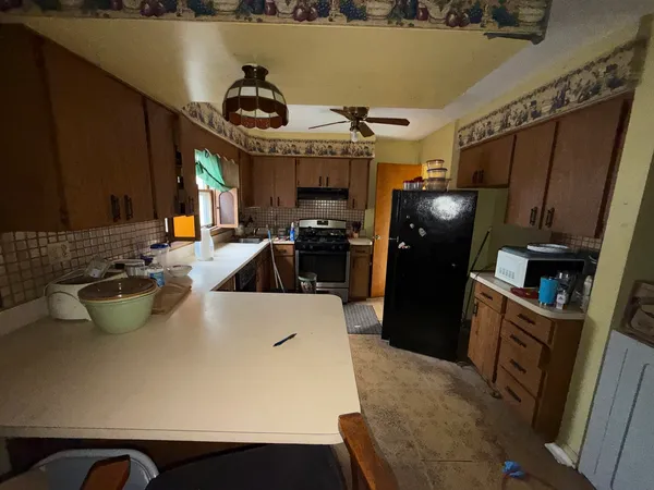 a kitchen with a sink and a stove top oven