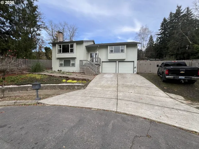 a view of a car park in front of house