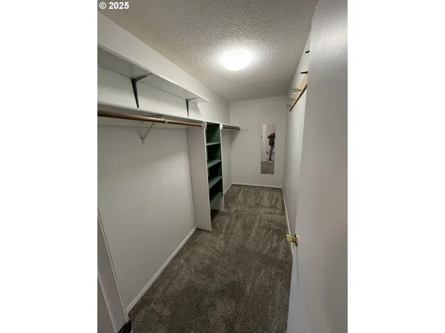 a view of a hallway with closet