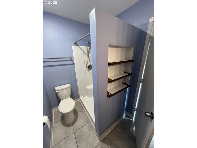a bathroom with a toilet and a sink