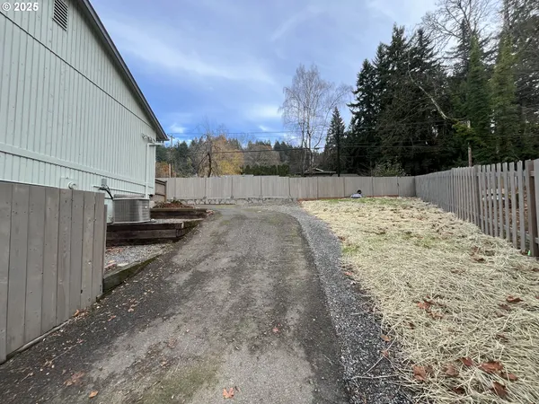 a view of a backyard of the house