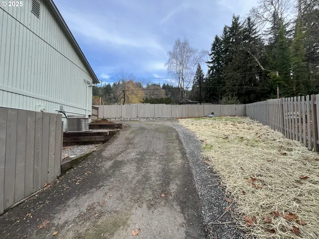 a view of a backyard of the house