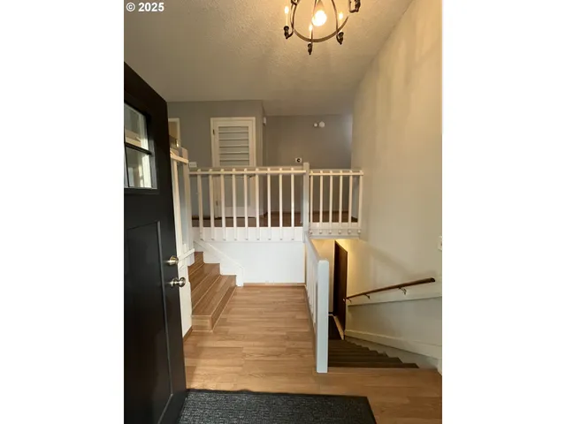 a view of a hallway with seating area