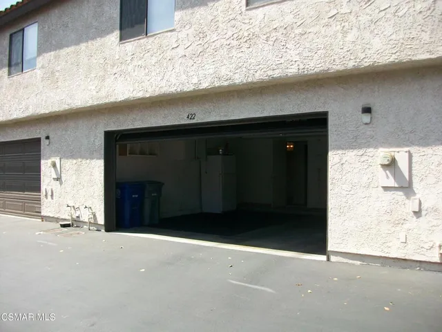 a front view of a house with a garage
