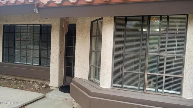 a view of a door and a window