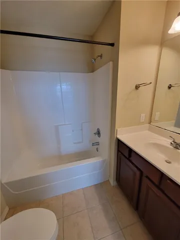 a bathroom with a sink a toilet and bathtub