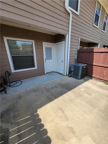a view of backyard with a large window