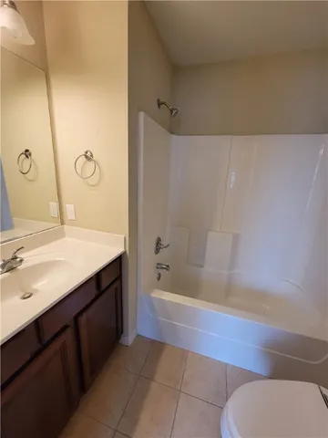 a bathroom with a sink a toilet and bathtub