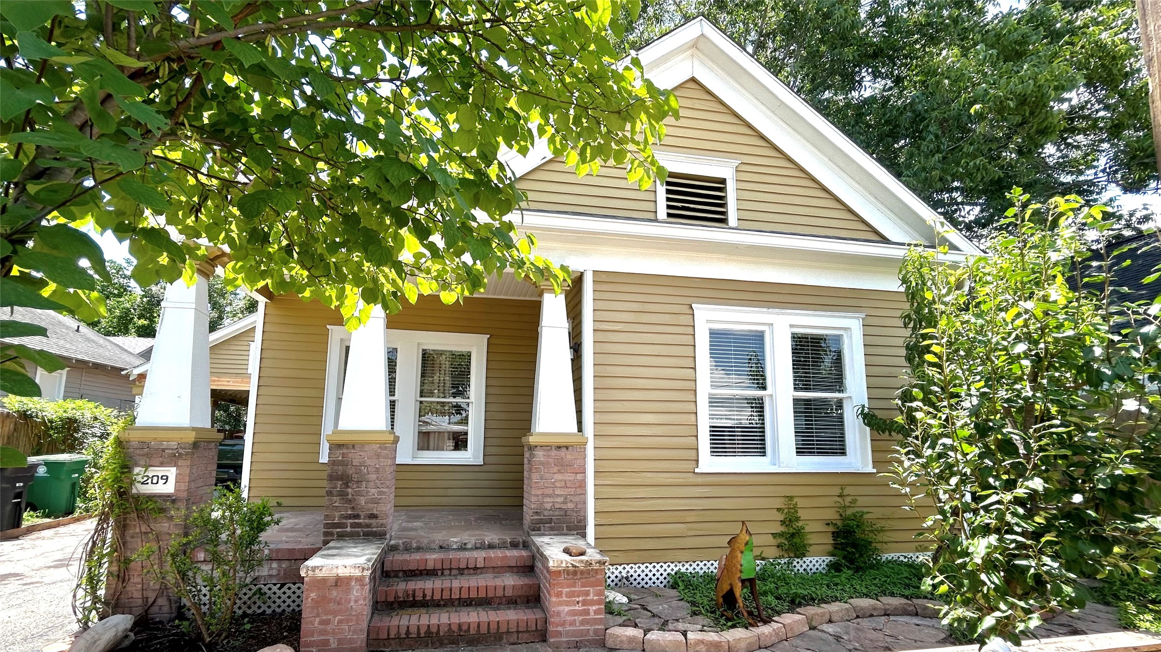 209 Walton Street Houston, TX 77009 - Photo 1 of 24 a view of a house with a tree