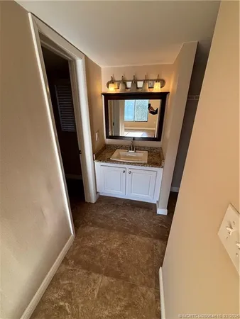 a view of front door with a sink