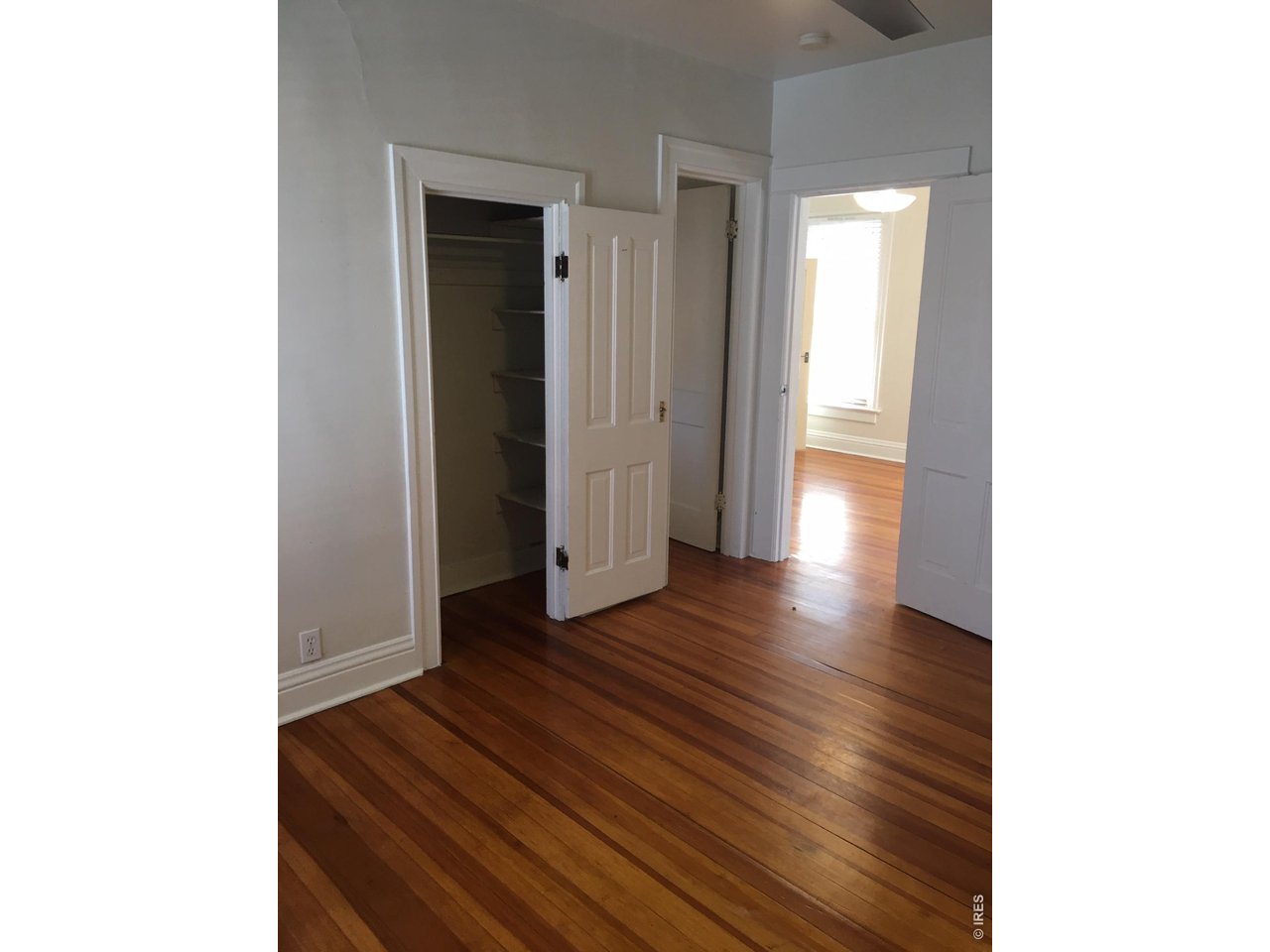 612 South Howes Street Fort Collins, CO 80521 - Photo 14 of 18 a view of a hallway with wooden floor