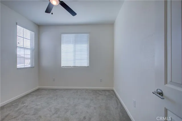 a view of a bathroom from a hallway